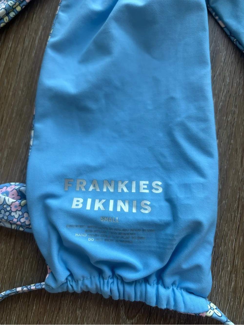 Frankie’s Bikinis blue floral bikini top and medium bottom